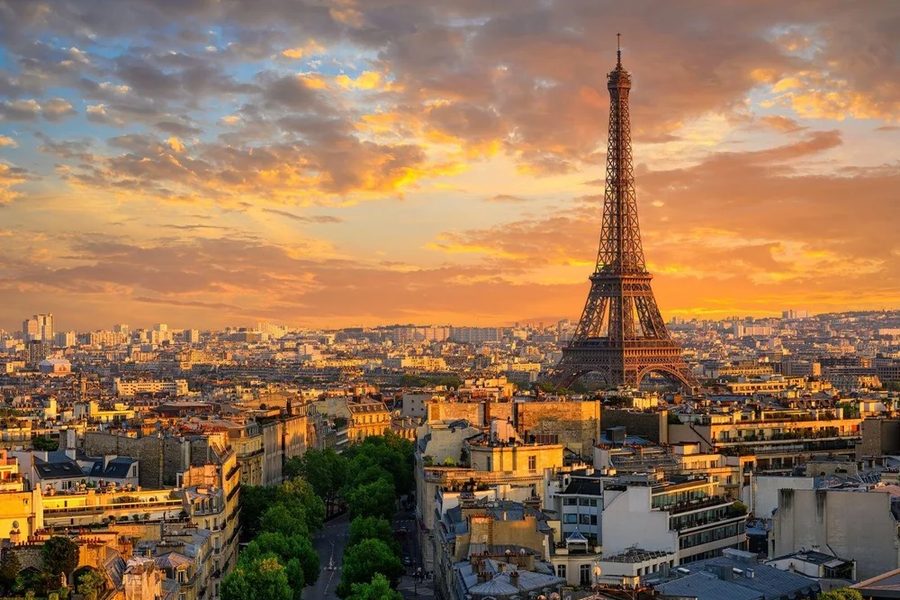 Paris rooftops and the Eiffel Tower at sunset