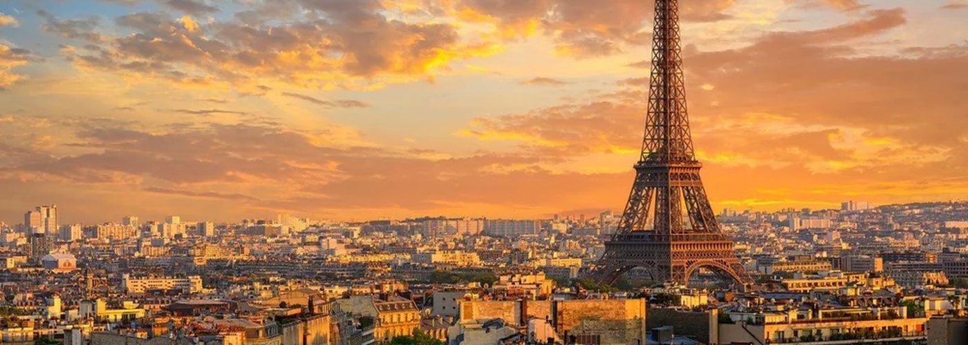 Paris rooftops and the Eiffel Tower at sunset