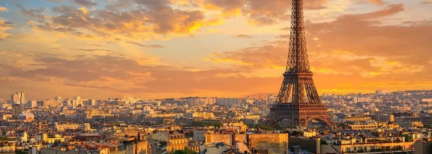 Paris rooftops and the Eiffel Tower at sunset